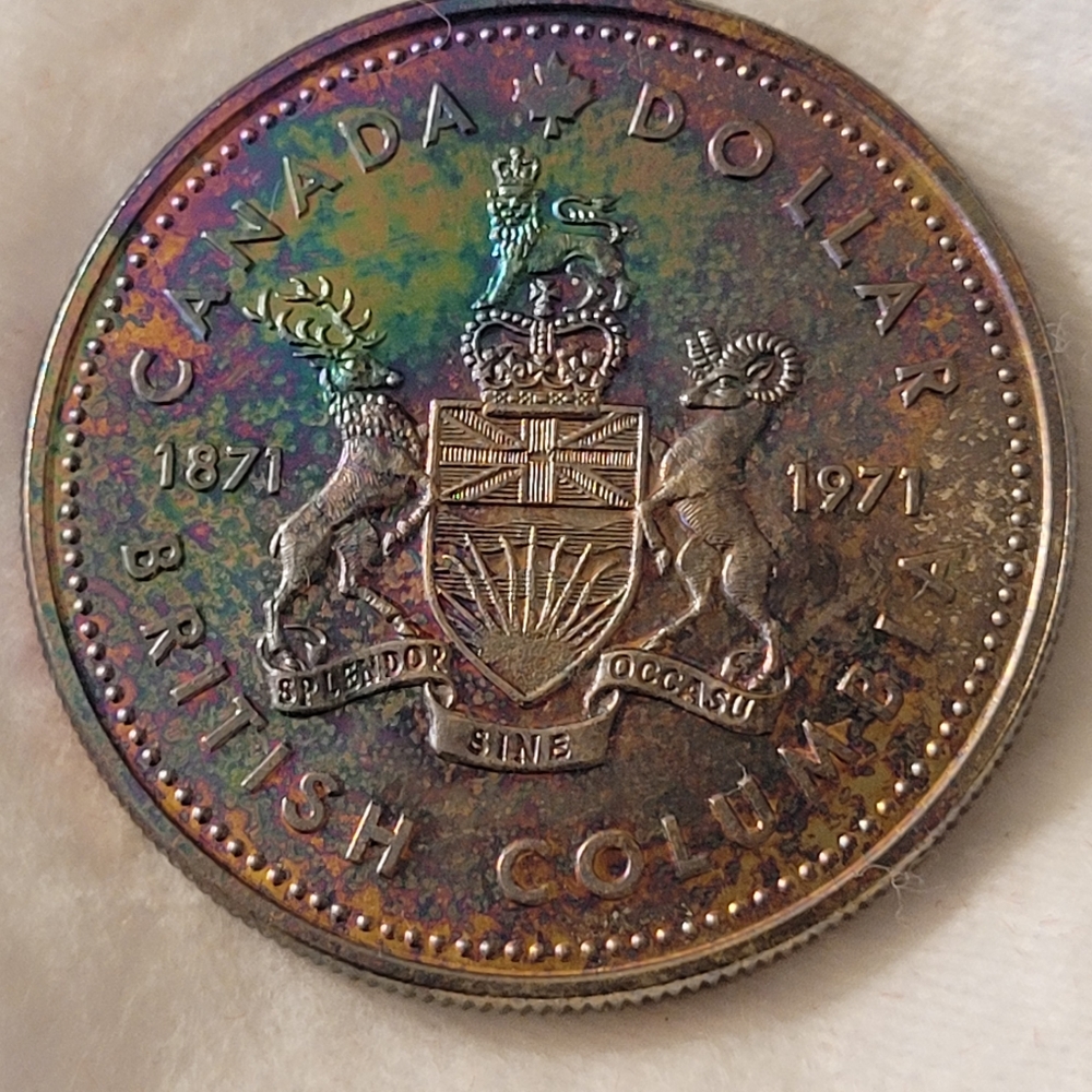 Silver Proof rainbow toned Canadian 1$ coin. 1971